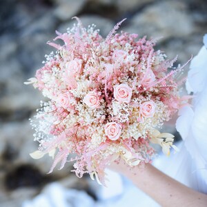 Pink rose and baby's breath bridal bouquet with pastel pink accents