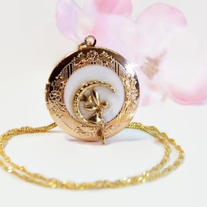 Gold-tone round fairy locket necklace with ornate frame and chain