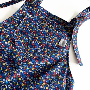 Blue floral dungarees with front pocket and adjustable shoulder straps