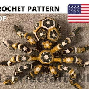 Crochet giant tarantula spider plush, yellow-and-black striped legs with flower motifs