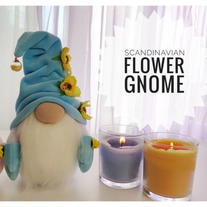 Blue fabric Scandinavian flower gnome with yellow flower accents