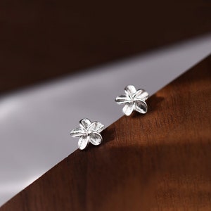 Tiny sterling silver flower stud earrings