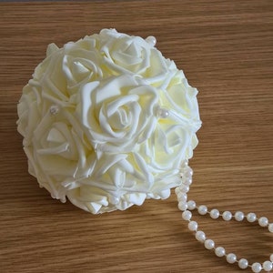 White wedding pomander with pearl handle and layered rose-style flower ball
