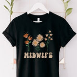 Black midwife shirt with floral bouquet graphic and “MIDWIFE” text on the front