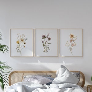Set of 3 framed wildflower line art prints with botanical stems in light frames