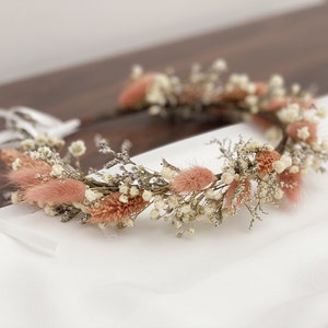 Dried baby’s breath bridal crown headband with white flowers, dried greenery, and pink bunny tails