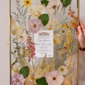 Pressed flower frame with glass front, dried blooms and a central greeting card