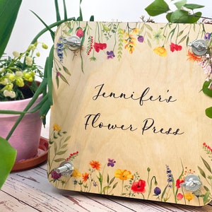 Personalized wooden flower press with floral design and “Jennifer” text