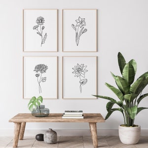 Framed botanical line art print set with four minimalist wildflower outlines
