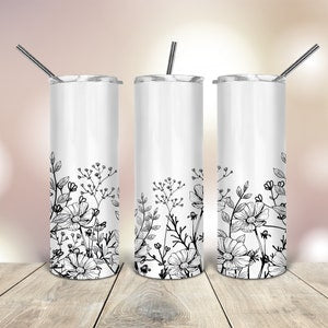 20 oz skinny tumbler with wildflower line art wrap, clear lid and silver straw