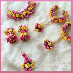Floral jewelry set with pink and yellow bead garland and matching earrings