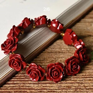 Red rose-bead flower bracelet with gold-tone spacers