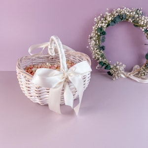 White flower girl basket with satin bow and ribbon handle