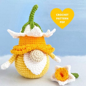 Crochet daffodil gnome pattern: orange hat, white beard, green stem, small flower