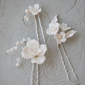 White floral hairpins with pearl centers, handmade clay blossoms, set of three