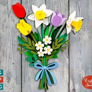 Layered spring flower bouquet design with yellow, white, purple blooms and green leaves