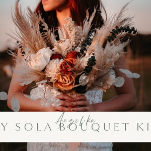 Wood flower bouquet DIY kit with orange roses, white petals, and dark feather-like accents