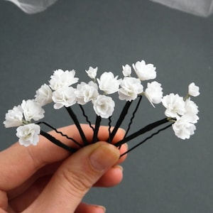 White baby’s breath flower hair pins with thin black stems, bridal headpiece