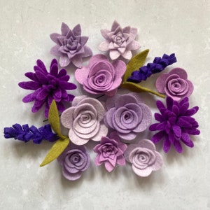 Assorted die-cut felt flowers in lilac, purple, and lavender tones