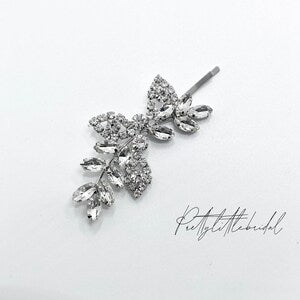 Rhinestone flower hair clip with crystal petals and metal clasp, silver tone