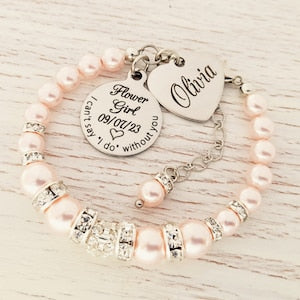 Pink bead flower girl bracelet with silver charms and engraved heart tag, gift-ready
