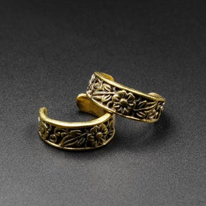 Brass flower and foliage ear cuff with engraved leaf pattern