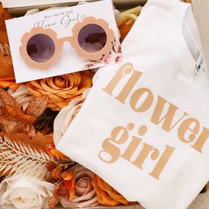 White toddler T-shirt with gold "flower girl" lettering print