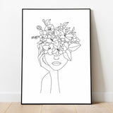 Framed wall art print: black line drawing woman with floral head, lilies, white background