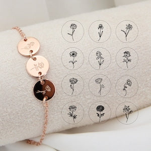 Personalized birth flower disc charm bracelet with rose-gold chain and floral initials