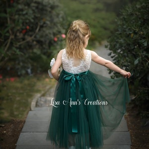 Green sleeveless flower girl tulle dress with satin bow waist, layered skirt