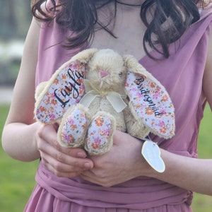 Soft plush bunny with floral applique ears and pastel flower pattern