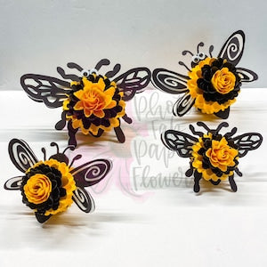 Mini paper flower set of four: black swirled butterfly flowers with orange-yellow centers