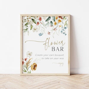 Wildflower flower bar sign print with floral bouquet illustrations, framed in light wood.