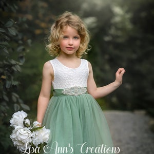 Sage green sleeveless flower girl dress with lace bodice and tulle skirt