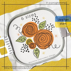 Watercolor floral machine embroidery design with orange rose swirl and green leaves in hoop