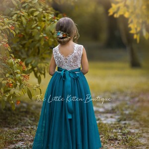 Teal lace flower girl dress with sleeveless lace bodice and full tulle skirt