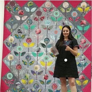 Folk flower quilt digital download pattern showing multicolor floral block layout