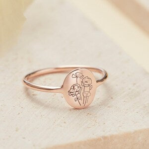 Rose gold birth flower ring with round center and engraved bouquet floral design