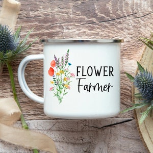 White enamel mug with flower illustration and 'FLOWER Farmer' text, curved handle