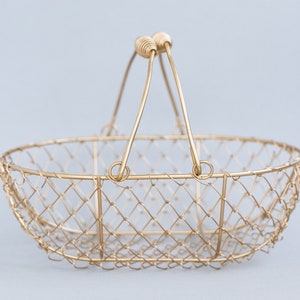 Champagne gold wire oblong basket with double swing handles