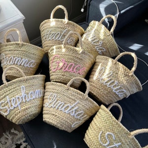 Mini straw personalized gift baskets with rope handles, printed cursive name on front