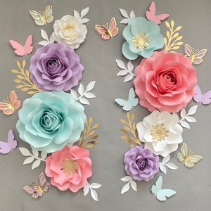 Paper flower wall decor set with lavender, pink, and blue roses, butterflies, and white blooms