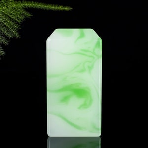 Square jade seal pendant with green and white carved flower pattern