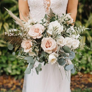 Artificial bridal bouquet with pale pink and white roses, eucalyptus-style greenery and white blooms