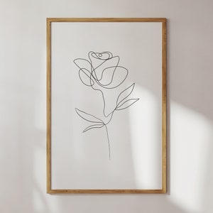 Framed one-line flower print with black line art rose on white