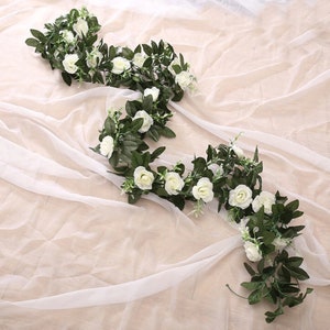Silk rose and leaf garland vine with white blooms and green foliage