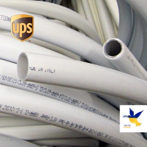 Gray flexible plastic tube pipe bundle with cut ends and printed markings