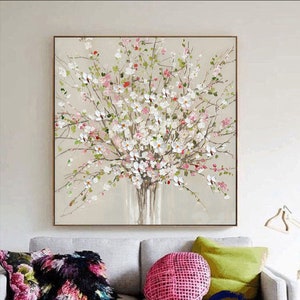 Framed abstract canvas painting with pink and white blossoms on a tree branch