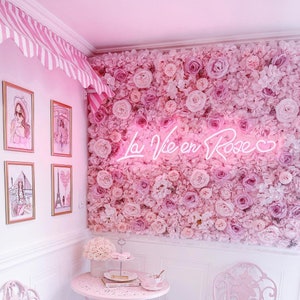Pink 3-D artificial flower wall panel with layered rosette blooms, curved corner view