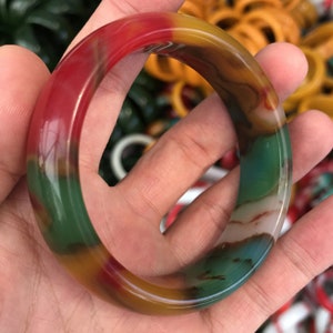 Jadeite jade bangle bracelet with translucent green, red, and amber bands